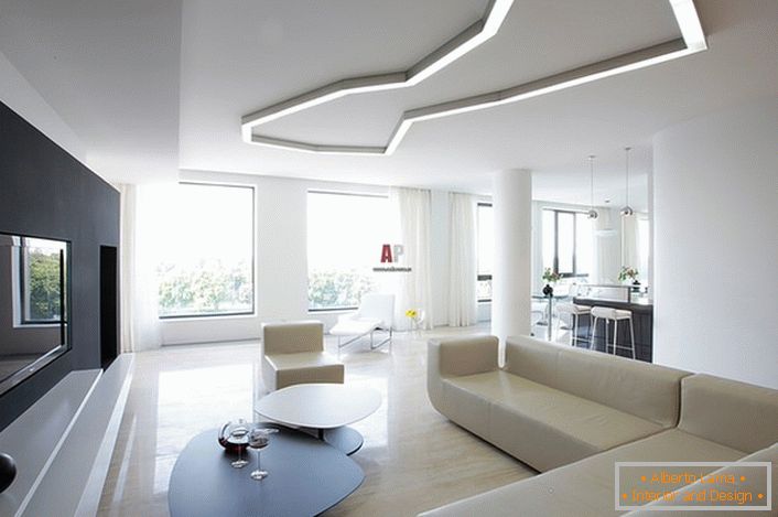 Пример за правилен избор на осветлување за дневната соба во стилот на минимализмот. Во согласност со барањата на стил во создавањето на внатрешни геометриски форми и строги линии се користат.