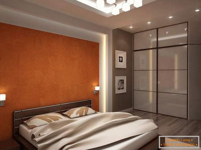 Функционална спална соба со добро избрано осветлување е направена во сива и светло-беж тонови. 