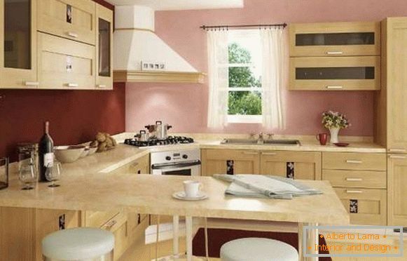 Внатрешноста на аголната кујна со бар контра - слика во беж и розова тонови