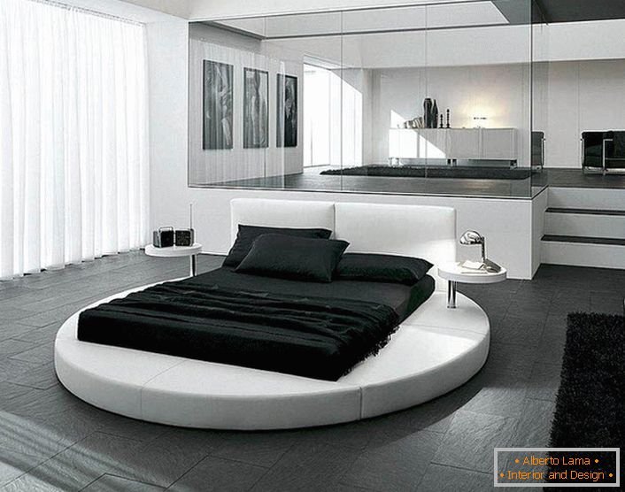 Дизајнот на спалната соба во стилот на минимализмот е нагласен со соодветно избраниот мебел. Интересен детаљ за внатрешноста е кружен кревет.
