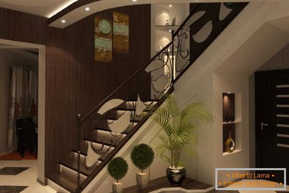 Дизајн на влезната сала со скалила во приватна куќа во темни тонови
