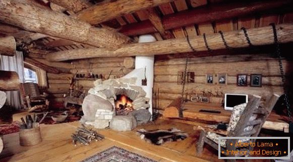Дрвена куќа внатре во земјата стил со камин шпорет