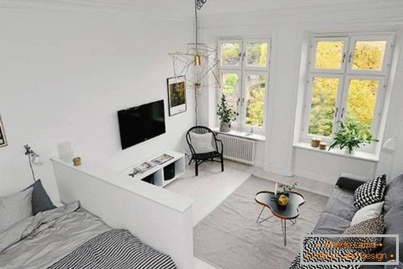 Еднособен стан во скандинавски стил - дневна соба и спална соба